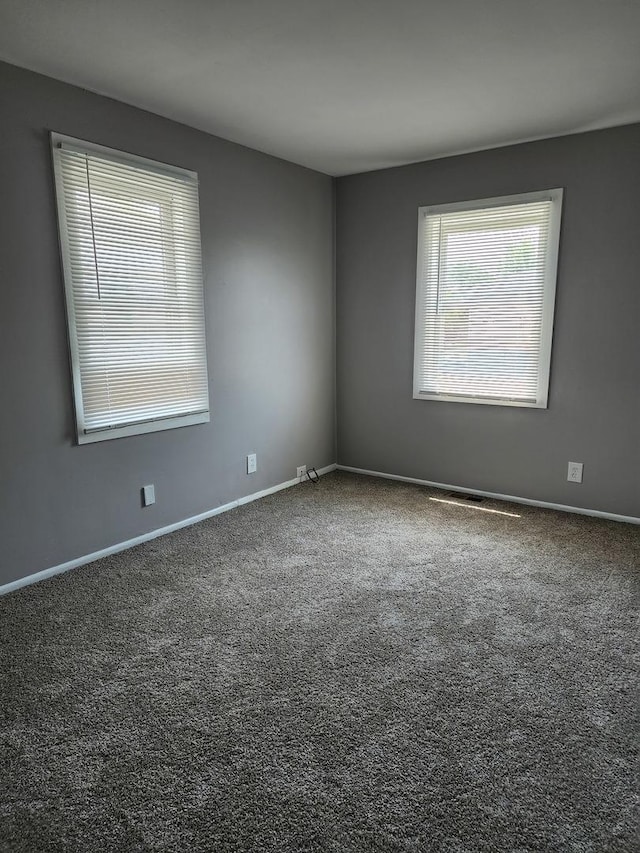 2330 Carnation Dr Unit 2330, Crest Hill, IL 60403 - spare room featuring carpet floors and baseboards