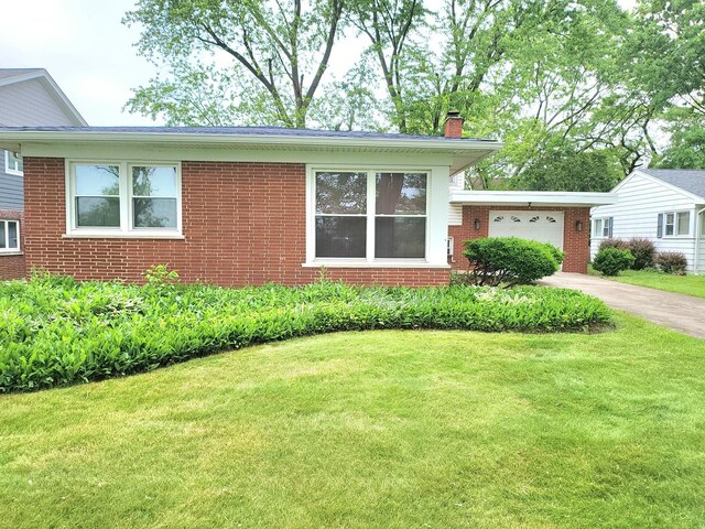 718 Central Park Ave, Flossmoor, IL 60422 - view of front of home featuring an attached garage, a chimney, brick siding, and a front lawn