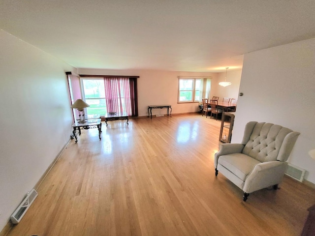718 Central Park Ave, Flossmoor, IL 60422 - living area featuring light wood-style floors and baseboards