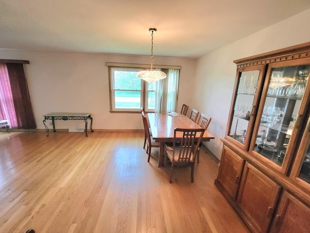 718 Central Park Ave, Flossmoor, IL 60422 - dining space featuring light wood-style flooring, a chandelier, and baseboards