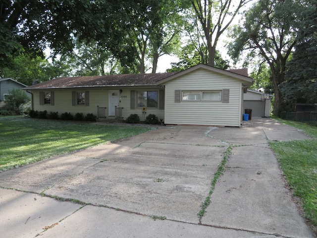 5280 S Harlan Dr, Rochelle, IL 61068 - ranch-style home with a front lawn and concrete driveway