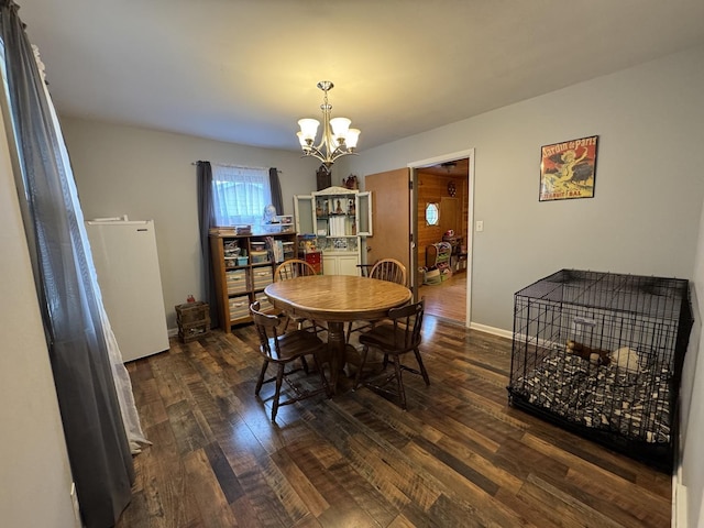 5280 S Harlan Dr, Rochelle, IL 61068 - dining area with a chandelier and dark wood-style floors