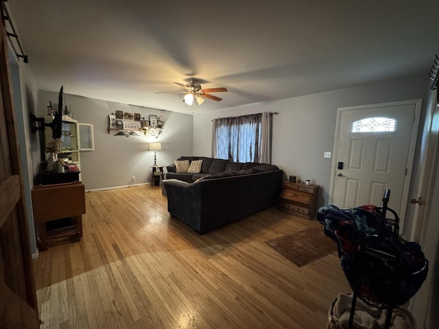 5280 S Harlan Dr, Rochelle, IL 61068 - living area featuring light wood-type flooring, ceiling fan, and baseboards