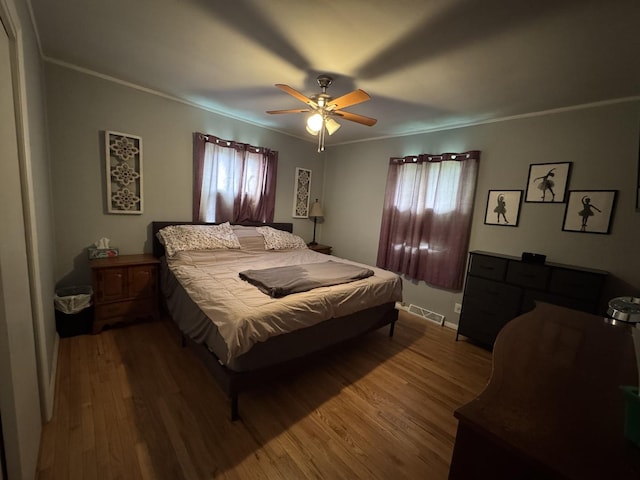 5280 S Harlan Dr, Rochelle, IL 61068 - bedroom with wood finished floors, crown molding, and ceiling fan