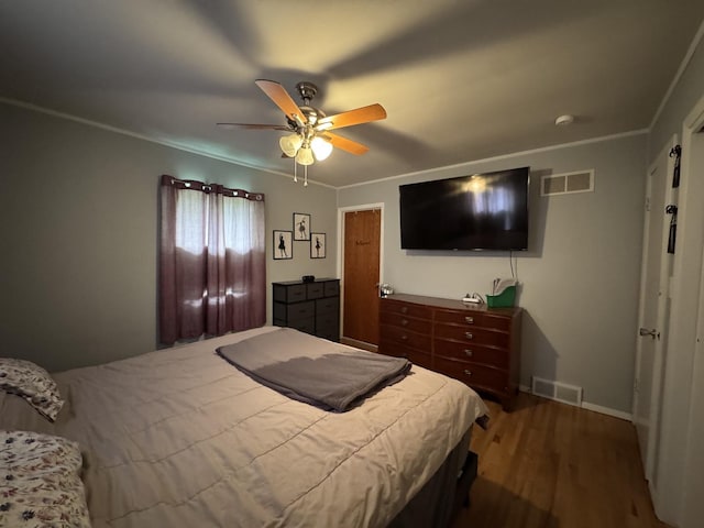 5280 S Harlan Dr, Rochelle, IL 61068 - bedroom with wood finished floors, a ceiling fan, baseboards, and ornamental molding