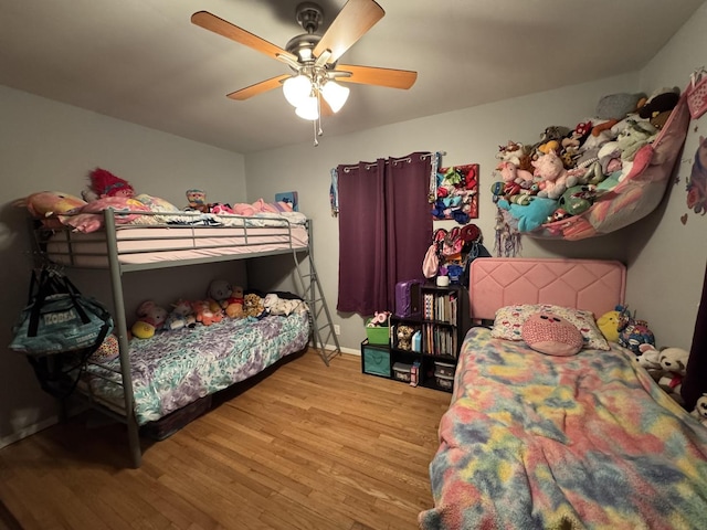 5280 S Harlan Dr, Rochelle, IL 61068 - bedroom with light wood finished floors, ceiling fan, and baseboards