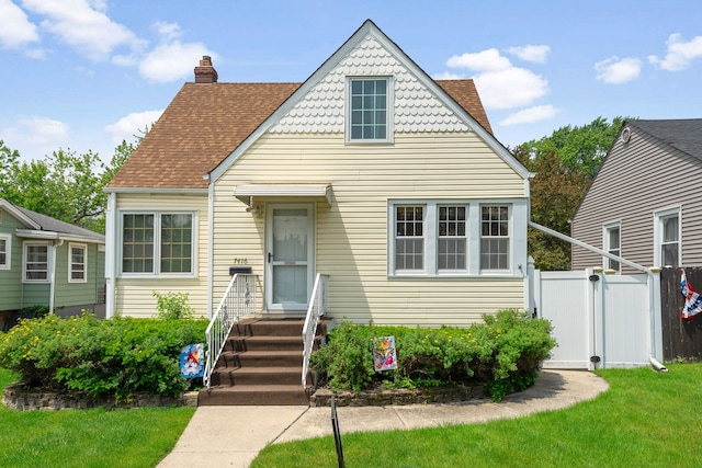 7416 Van Buren Ave, Hammond, IN 46324 - view of front of property featuring a chimney, roof with shingles, and entry steps