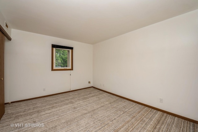 3525 Saint Anthony Way Unit 7A, Rockford, IL 61101 - spare room featuring light carpet