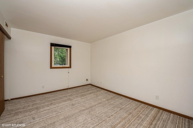 3525 Saint Anthony Way Unit 7A, Rockford, IL 61101 - empty room featuring light colored carpet and baseboards