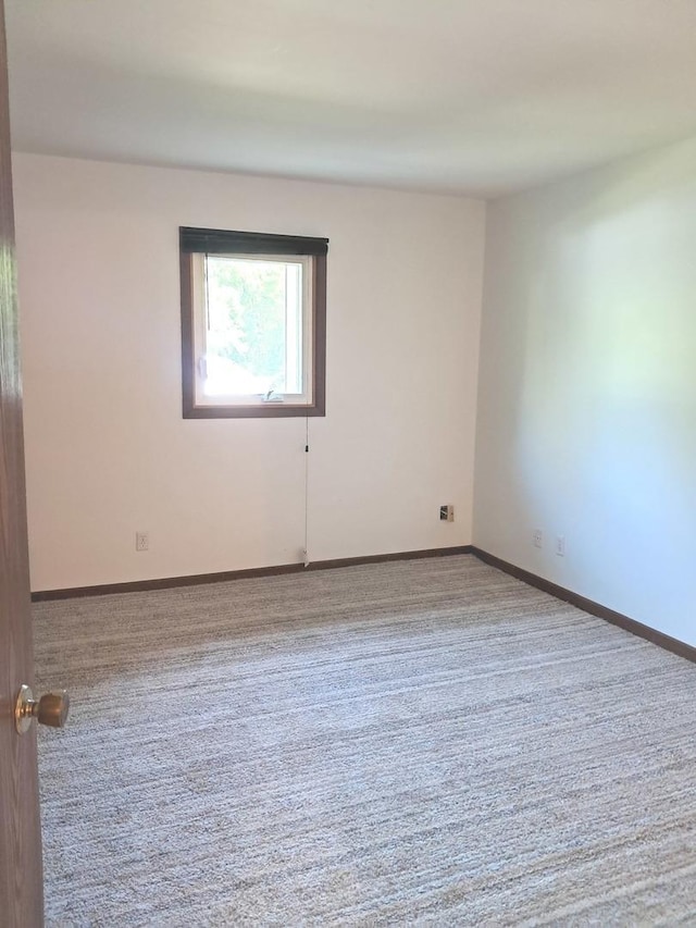 3525 Saint Anthony Way Unit 7A, Rockford, IL 61101 - carpeted spare room featuring baseboards