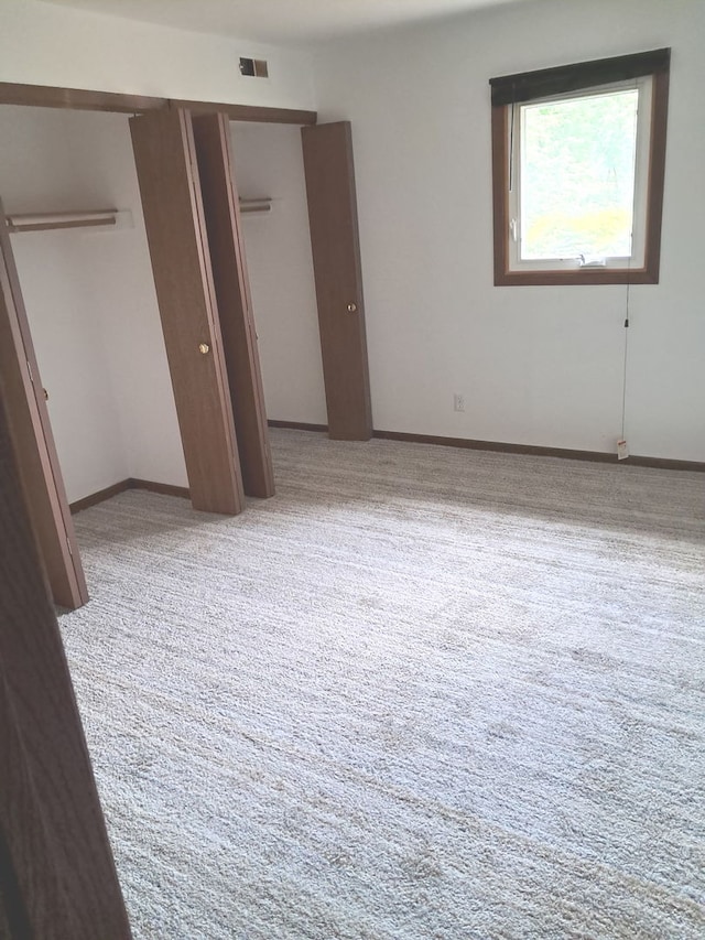 3525 Saint Anthony Way Unit 7A, Rockford, IL 61101 - unfurnished bedroom featuring carpet floors and a closet