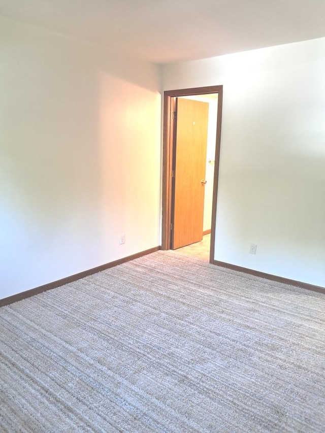 3525 Saint Anthony Way Unit 7A, Rockford, IL 61101 - empty room with light carpet and baseboards