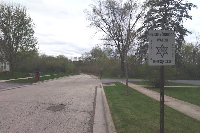3525 Saint Anthony Way Unit 7A, Rockford, IL 61101 - view of asphalt street featuring curbs and sidewalks