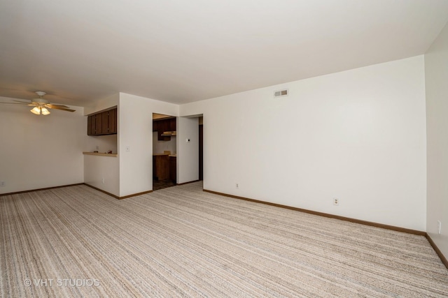 3525 Saint Anthony Way Unit 7A, Rockford, IL 61101 - unfurnished living room with light colored carpet and a ceiling fan