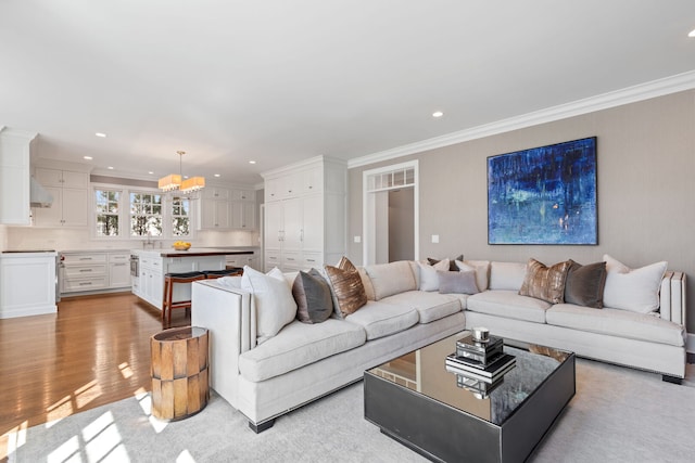 622 S Washington St, Hinsdale, IL 60521 - living area with crown molding, recessed lighting, a chandelier, and light wood finished floors