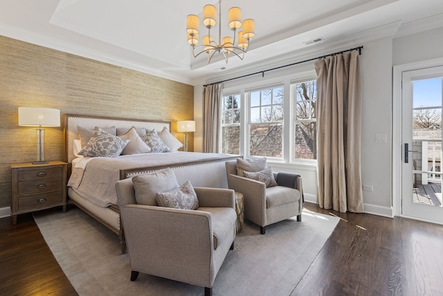 622 S Washington St, Hinsdale, IL 60521 - bedroom with wood finished floors, a chandelier, a raised ceiling, and an accent wall