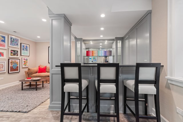 622 S Washington St, Hinsdale, IL 60521 - bar area featuring recessed lighting, crown molding, and wood finished floors