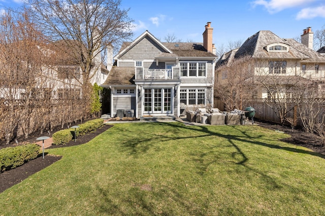 622 S Washington St, Hinsdale, IL 60521 - rear view of property featuring a balcony, a fenced backyard, entry steps, a chimney, and an outdoor living space