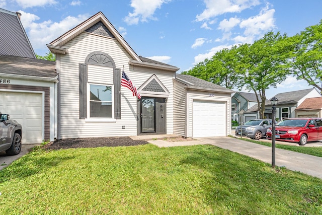 7490 Filmore Ave, Hanover Park, IL 60133 - view of front facade featuring driveway, an attached garage, and a front yard