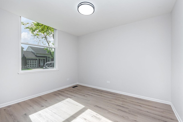 7490 Filmore Ave, Hanover Park, IL 60133 - unfurnished room with wood finished floors and baseboards
