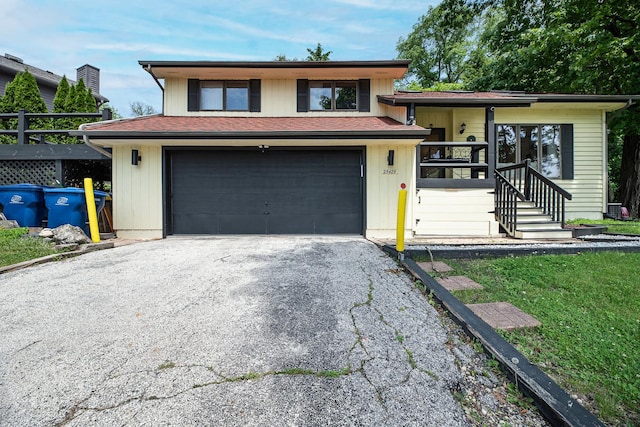 25429 W Cedar Crest Ln, Lake Villa, IL 60046 - tri-level home with asphalt driveway and a garage