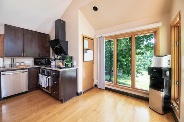 25429 W Cedar Crest Ln, Lake Villa, IL 60046 - kitchen with stainless steel appliances, wall chimney range hood, light wood finished floors, dark brown cabinets, and vaulted ceiling