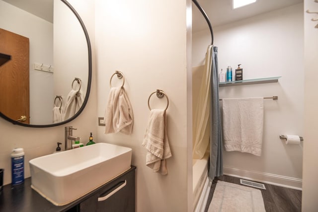 25429 W Cedar Crest Ln, Lake Villa, IL 60046 - bathroom with wood finished floors, vanity, and shower / tub combo with curtain