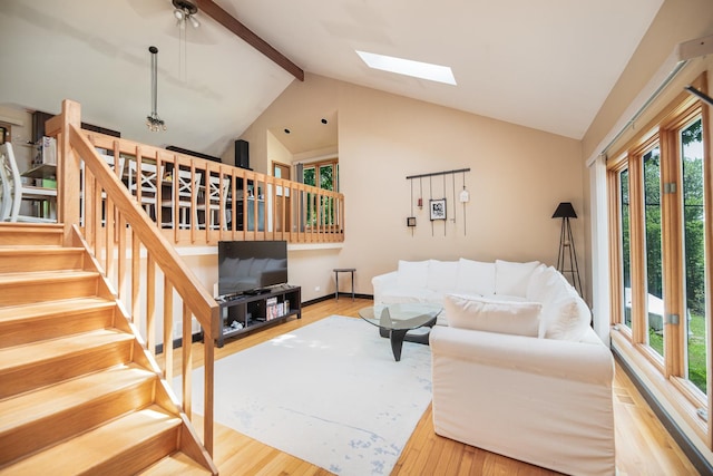 25429 W Cedar Crest Ln, Lake Villa, IL 60046 - living room with wood finished floors, plenty of natural light, beamed ceiling, a skylight, and high vaulted ceiling