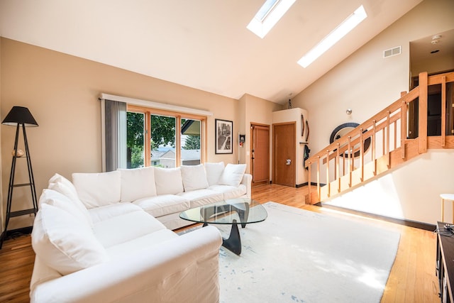25429 W Cedar Crest Ln, Lake Villa, IL 60046 - living area with stairway, a skylight, high vaulted ceiling, and wood finished floors