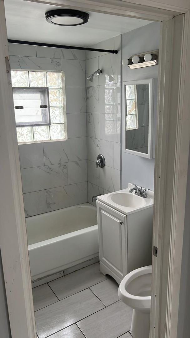 8205 S Houston Ave, Chicago, IL 60617 - full bathroom with vanity and bathing tub / shower combination