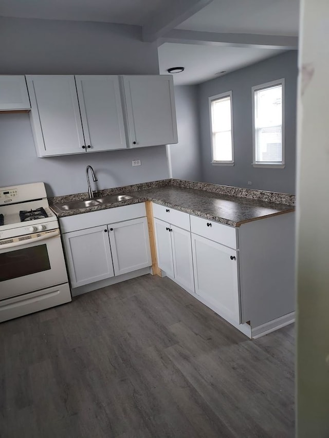 8205 S Houston Ave, Chicago, IL 60617 - kitchen featuring white range with gas cooktop, dark countertops, beamed ceiling, dark wood finished floors, and white cabinets