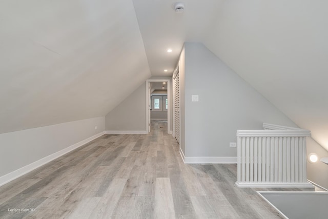 5448 N Lieb Ave, Chicago, IL 60630 - additional living space with light wood-style floors, lofted ceiling, and baseboards
