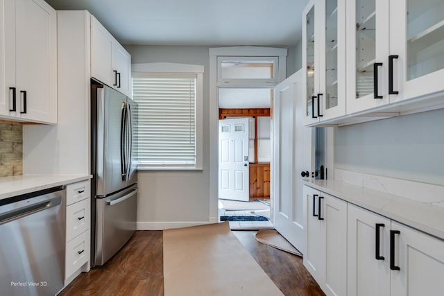 5448 N Lieb Ave, Chicago, IL 60630 - kitchen featuring appliances with stainless steel finishes, white cabinets, and dark wood-type flooring