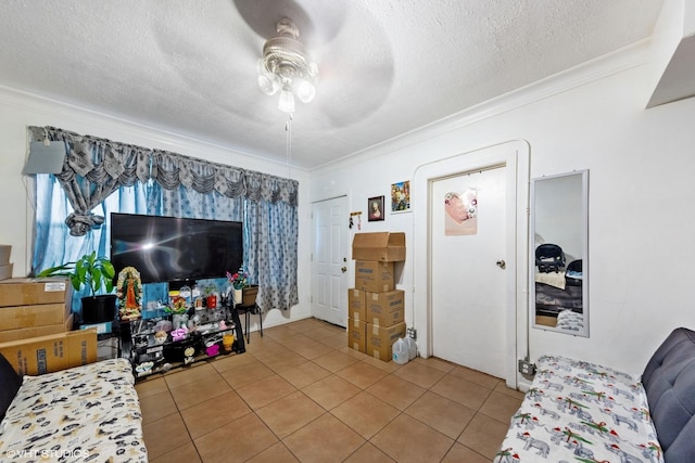 2625 S Drake Ave, Chicago, IL 60623 - living room with crown molding, ceiling fan, light tile patterned flooring, and a textured ceiling