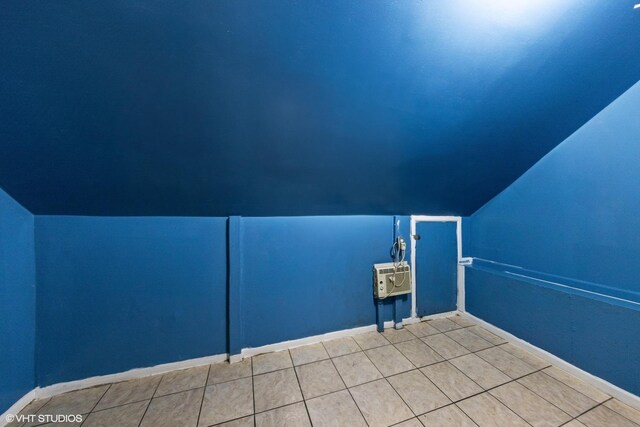 2625 S Drake Ave, Chicago, IL 60623 - additional living space with vaulted ceiling, tile patterned floors, and a wall unit AC