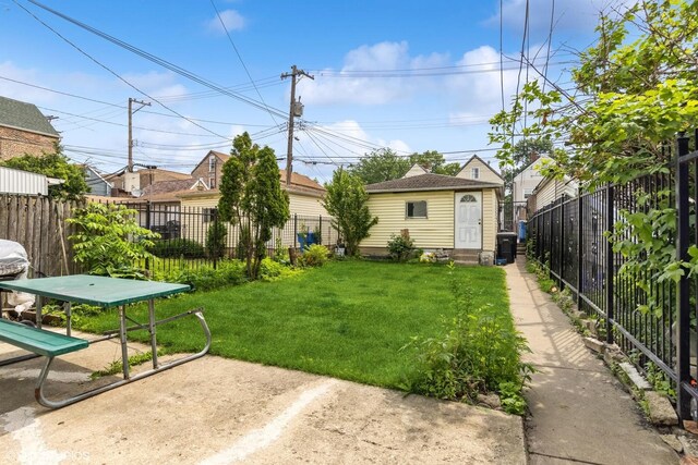2625 S Drake Ave, Chicago, IL 60623 - fenced backyard featuring an outbuilding, entry steps, and a patio