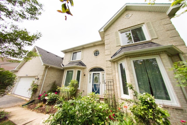 1034 Idaho St, Carol Stream, IL 60188 - view of front of property with brick siding, an attached garage, and driveway