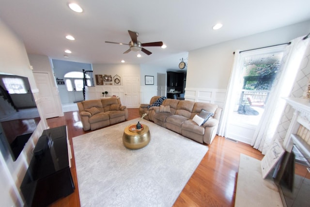 1034 Idaho St, Carol Stream, IL 60188 - living area with ceiling fan, wood finished floors, a decorative wall, a fireplace with flush hearth, and recessed lighting