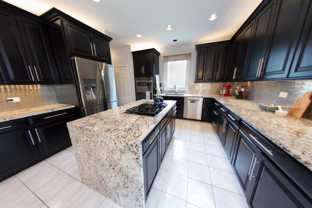 1034 Idaho St, Carol Stream, IL 60188 - kitchen with appliances with stainless steel finishes, dark cabinets, decorative backsplash, a sink, and recessed lighting