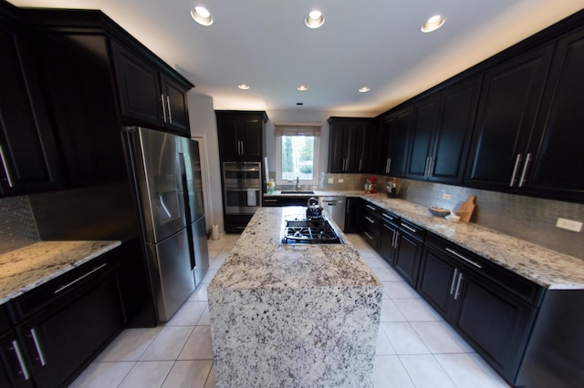 1034 Idaho St, Carol Stream, IL 60188 - kitchen featuring stainless steel appliances, decorative backsplash, light tile patterned flooring, light stone countertops, and a sink