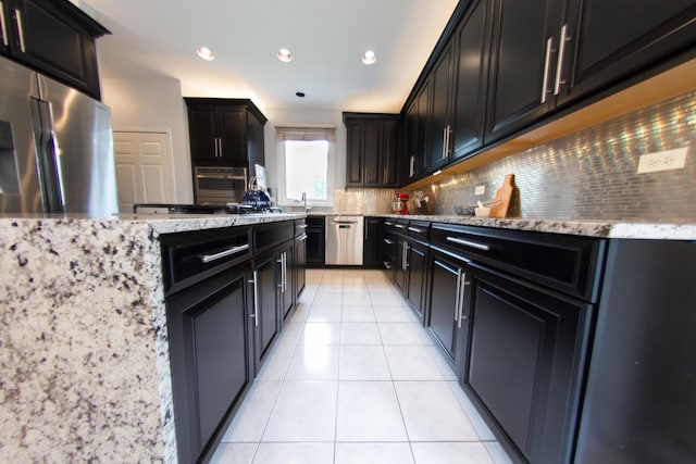 1034 Idaho St, Carol Stream, IL 60188 - kitchen with stainless steel appliances, tasteful backsplash, light stone countertops, light tile patterned floors, and recessed lighting