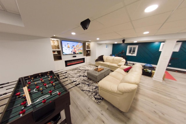 1034 Idaho St, Carol Stream, IL 60188 - recreation room featuring wood finished floors, recessed lighting, built in shelves, a glass covered fireplace, and baseboards