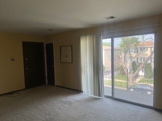 10936 S Keating Ave Unit 3C, Oak Lawn, IL 60453 - carpeted spare room with electric panel