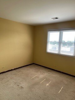 10936 S Keating Ave Unit 3C, Oak Lawn, IL 60453 - spare room with carpet and baseboards