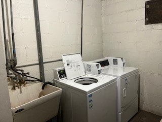 10936 S Keating Ave Unit 3C, Oak Lawn, IL 60453 - laundry room featuring washer and clothes dryer, concrete block wall, and a sink