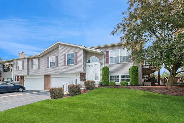 19927 S Edinburgh Ln Unit 0, Frankfort, IL 60423 - view of front of house with a garage, a front lawn, driveway, and a chimney