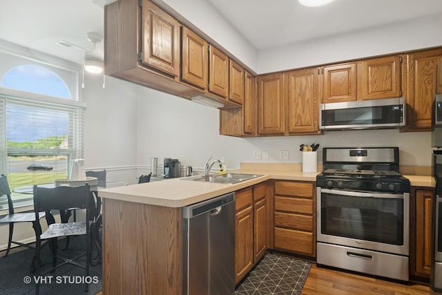 54 S Stonington Dr Unit 92, Palatine, IL 60074 - kitchen featuring stainless steel appliances, light countertops, and brown cabinets
