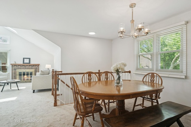 54 S Stonington Dr Unit 92, Palatine, IL 60074 - dining area featuring light colored carpet, a chandelier, and a fireplace