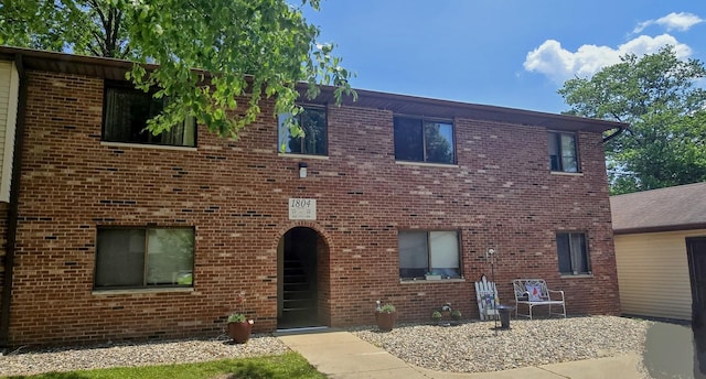 1804 Oliver Dr Unit 8, Urbana, IL 61802 - view of front of home with brick siding and a patio area