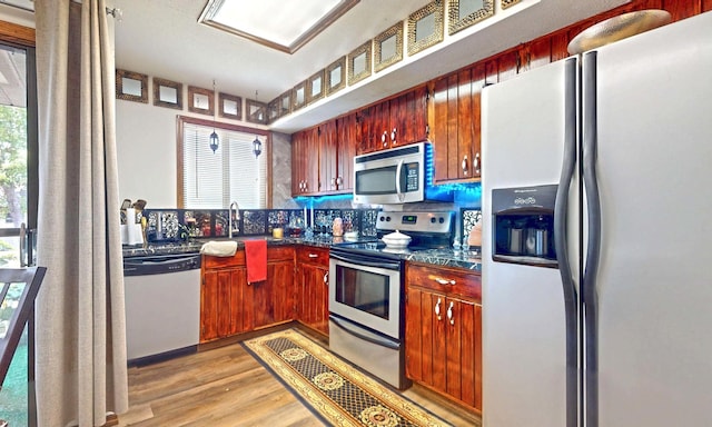 1804 Oliver Dr Unit 8, Urbana, IL 61802 - kitchen with appliances with stainless steel finishes, dark countertops, and light wood finished floors